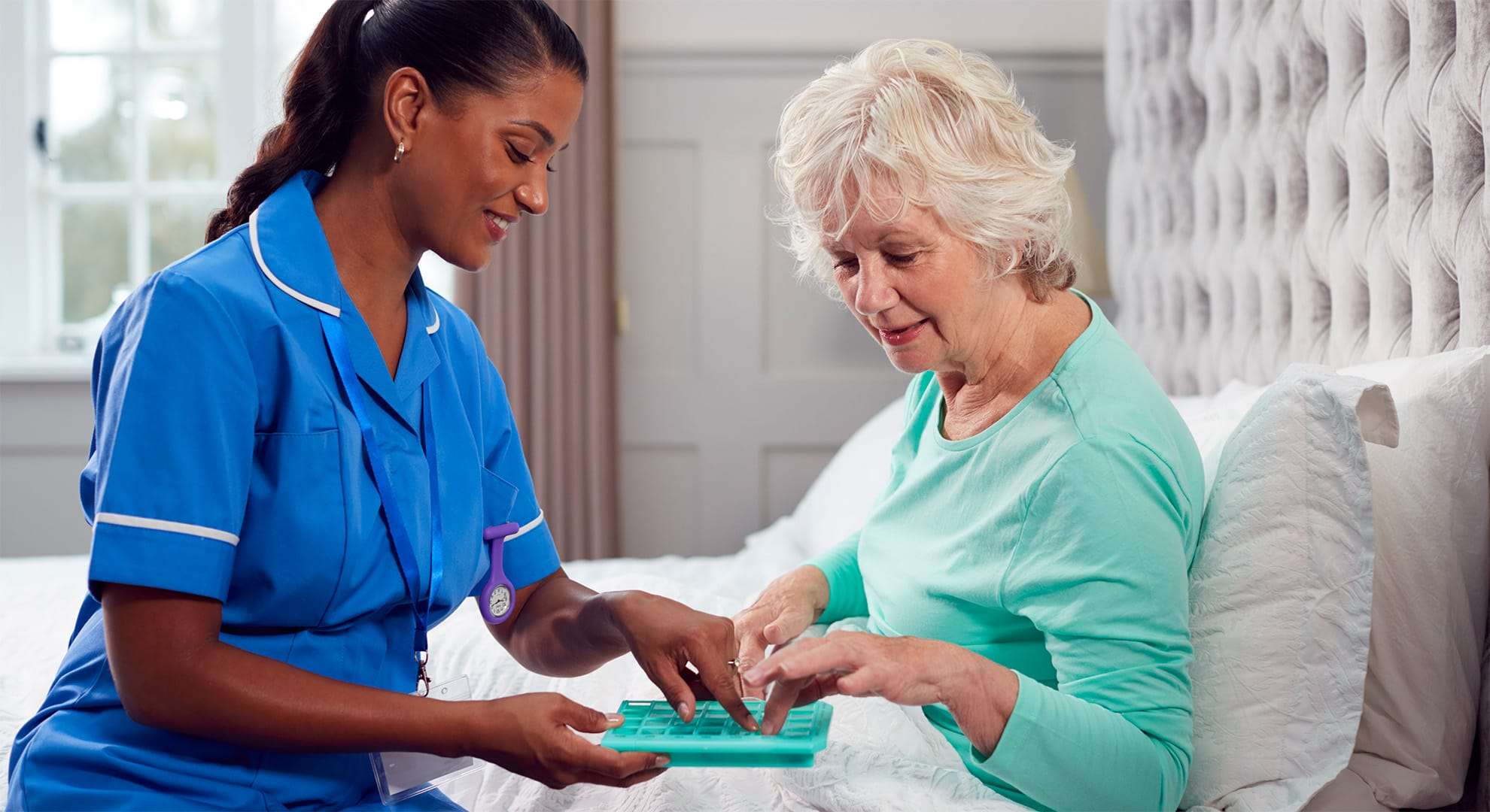 Care worker helping woman.